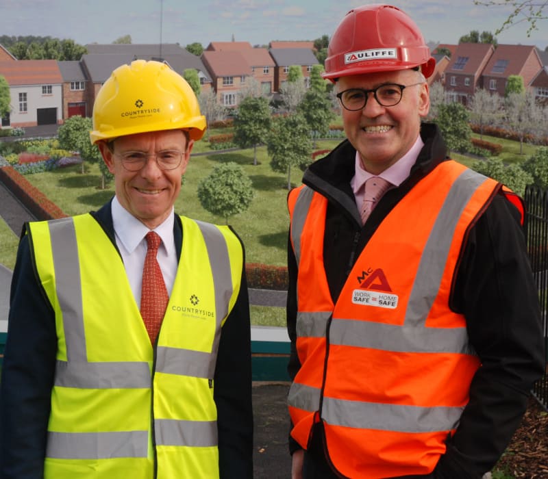 Managing Director John McAuliffe pictured with then Mayor of the West Midlands Andy Street during works at the Bilston Urban Village development site.