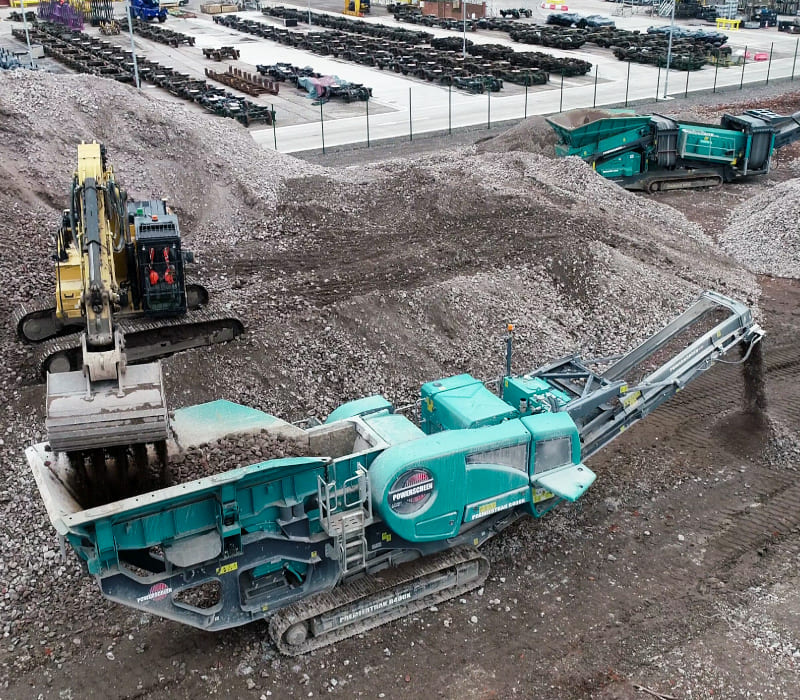Brownfield remediation carried out using specialised machinery to move materials.