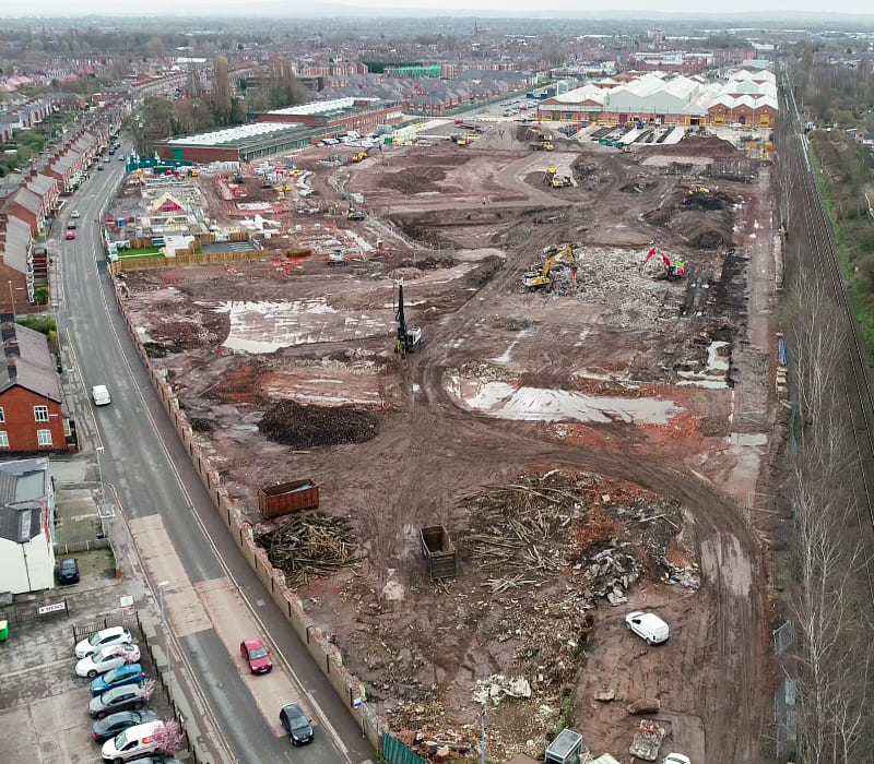 Aerial view of remediation strategy showcasing complex temporary works to manage the demolition of the 13m-high boundary wall.